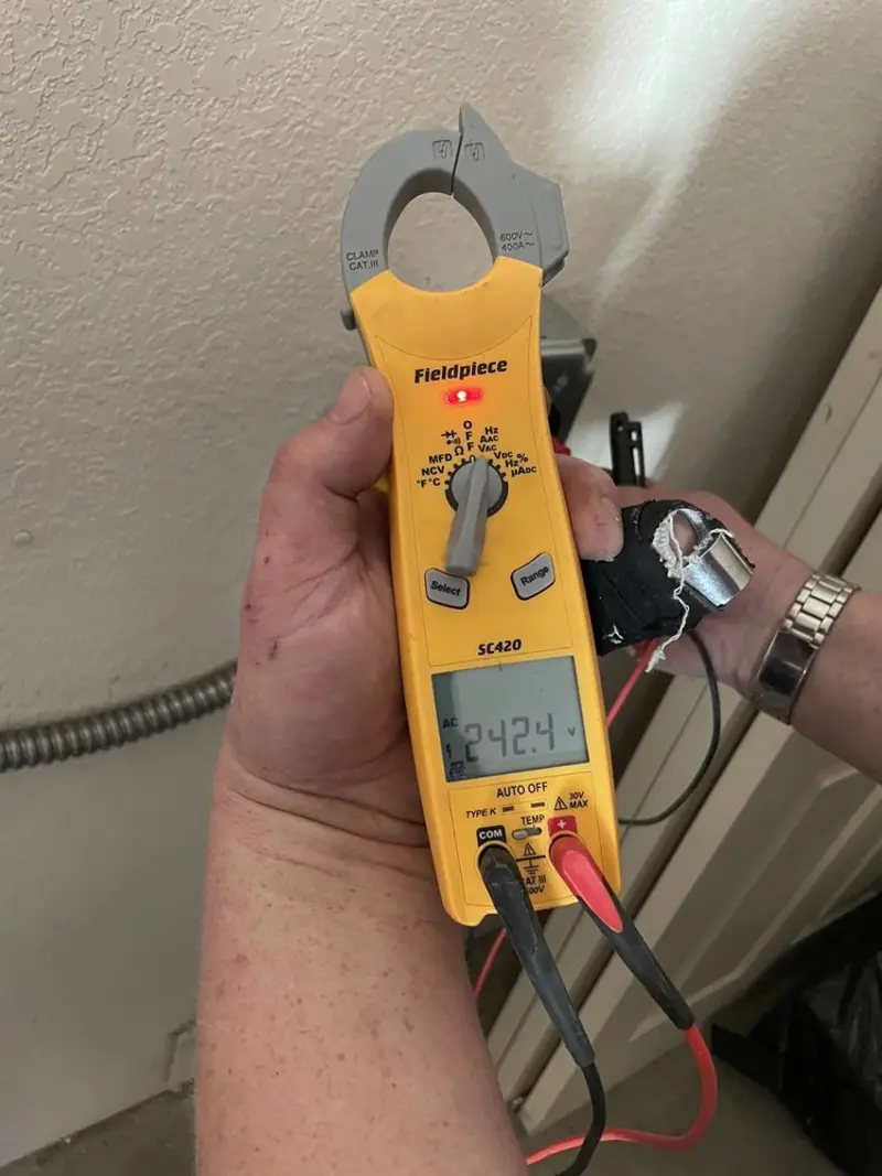 Voltage testing with clamp meter during Electrical Installation Services in Ashtabula